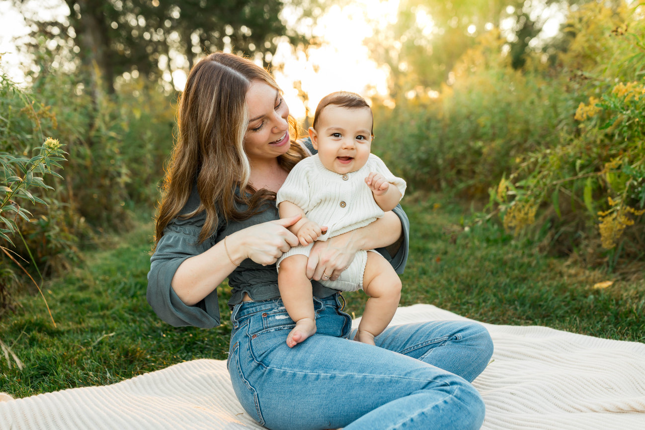 Mom and son sitting on blanket in outdoor family photo session