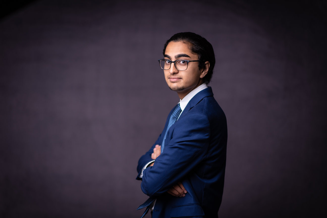 Portrait of a young man in a blue suit