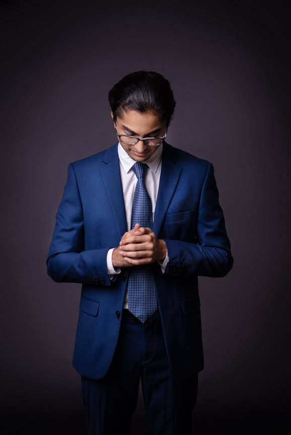 Portrait of a young man in a blue suit