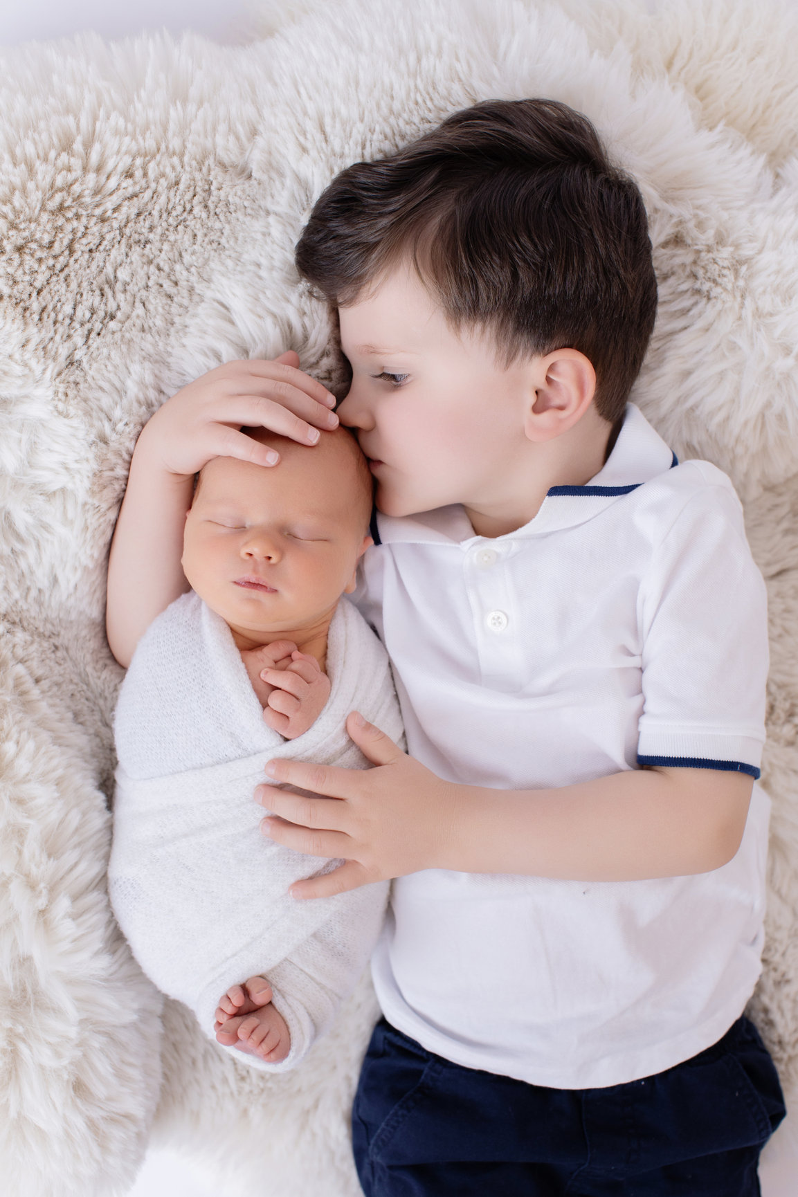 Calgary newborn photography white mauve and big brother love Newborn III session photo 14