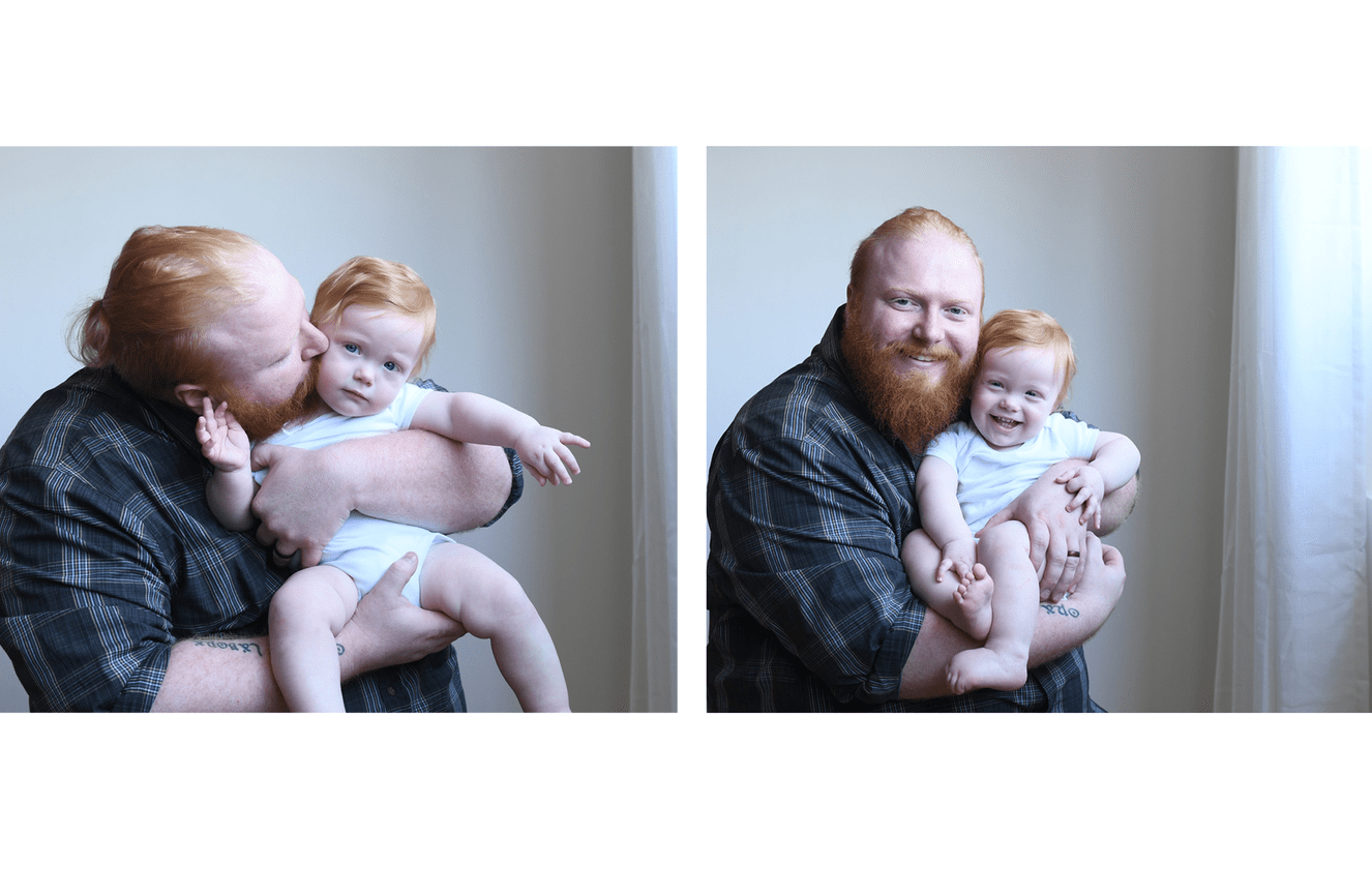 A redheaded father kissing the cheek of his redheaded toddler son at Kliks Photography.