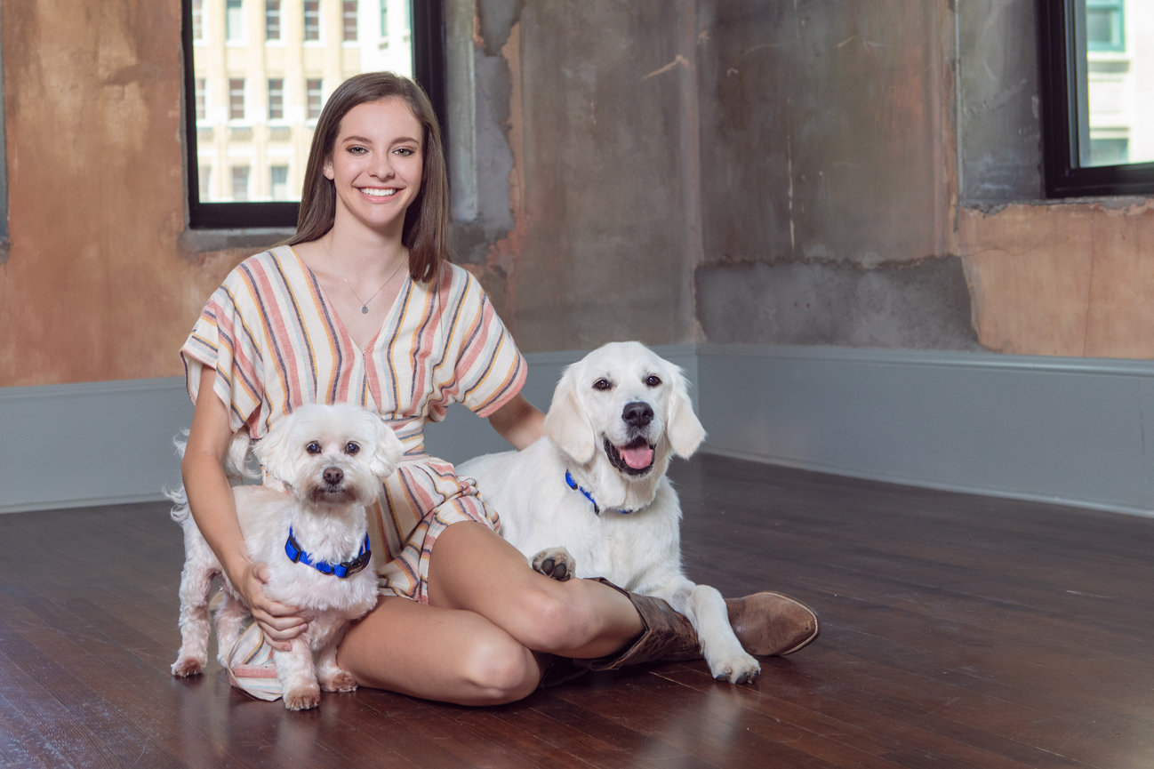 Senior portrait of a girl and her two dogs in fort worth.