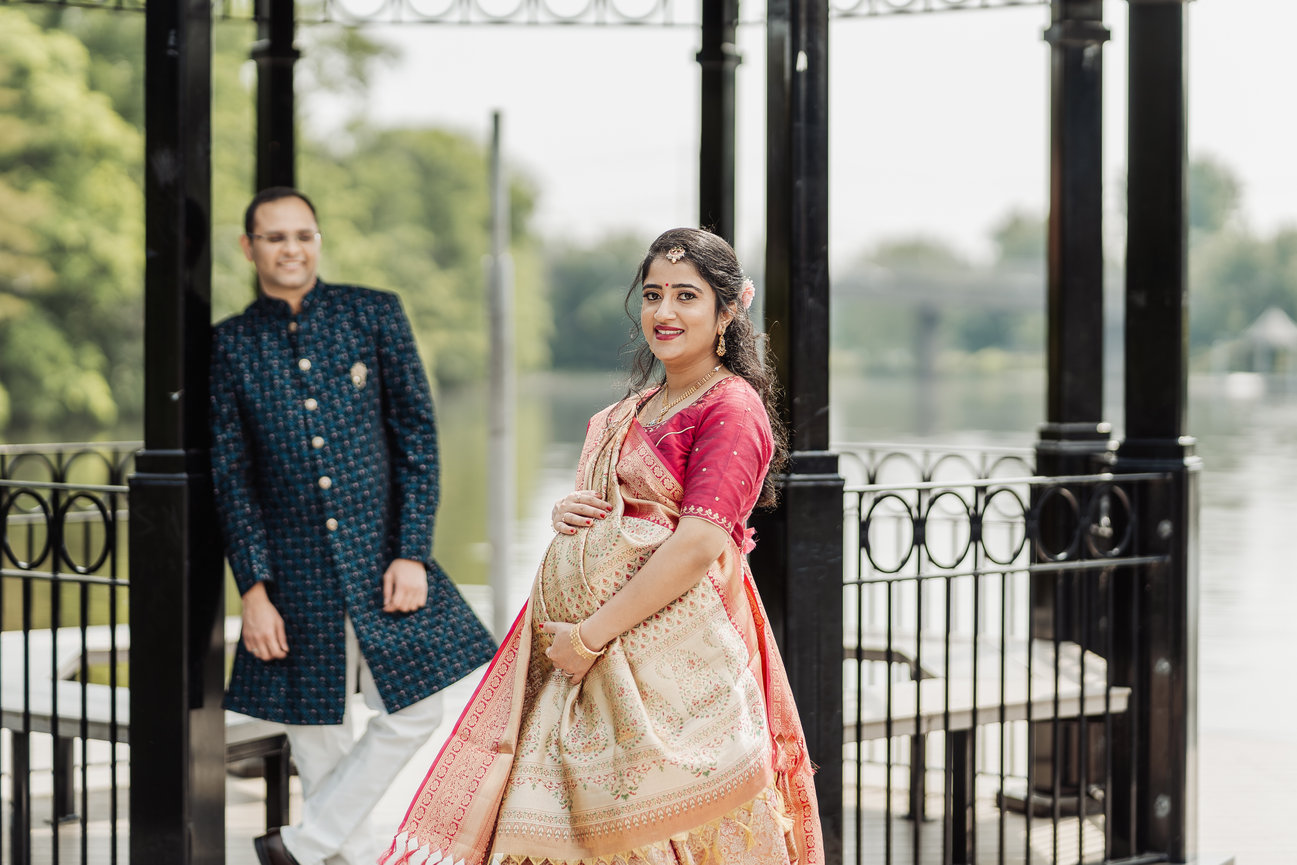 Couple walking together by an ornate gate